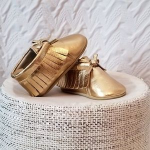 Gold moccasins